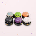 Boîte mystère Halloween : les 6 squishies surprise possibles, fond rose