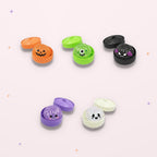 Squishies Brioche Fantôme pieuvre dans leurs boîtes, fond rose