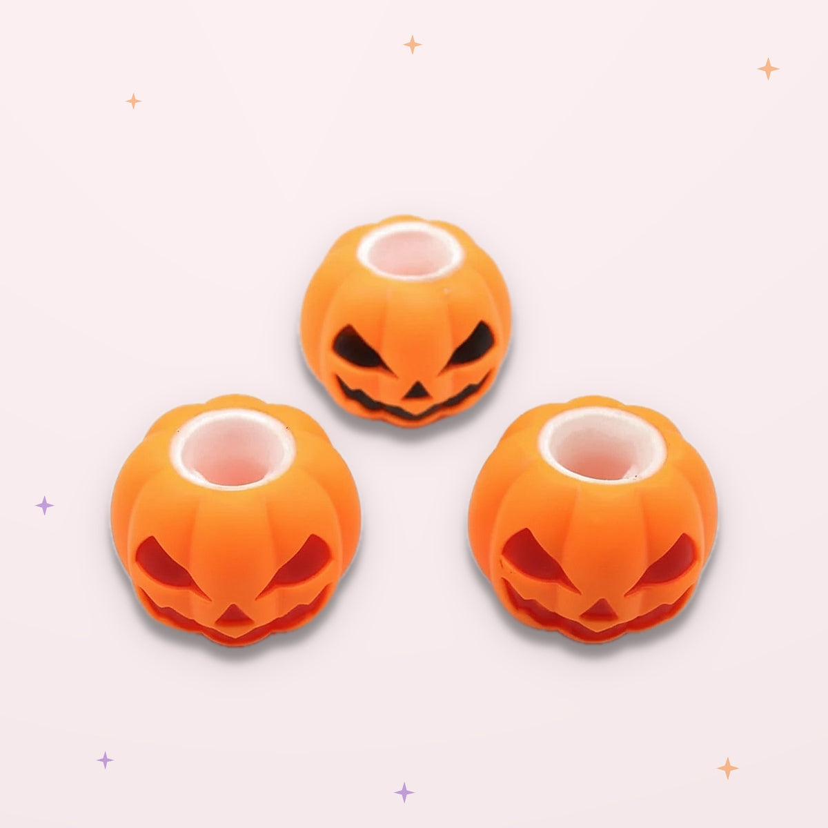 Squishies Citrouille souriante sur fond rose