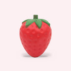Squishy géant fraise slow rising, packshot sur fond rose clair